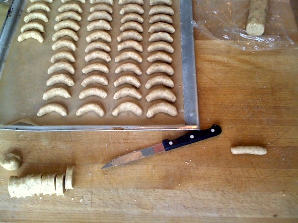 
Cut rolls and form each slice into a half moon shape