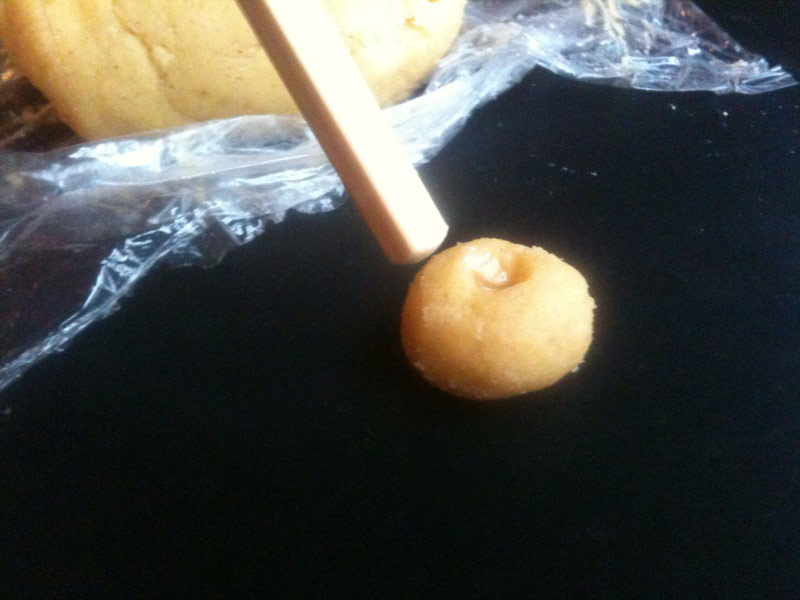 
Create a small dimple in the middle of each dough ball